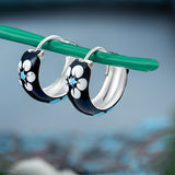 92.5 sterling silver hoops/baali with enamel and printed flowers finished in silver and hinged back closure