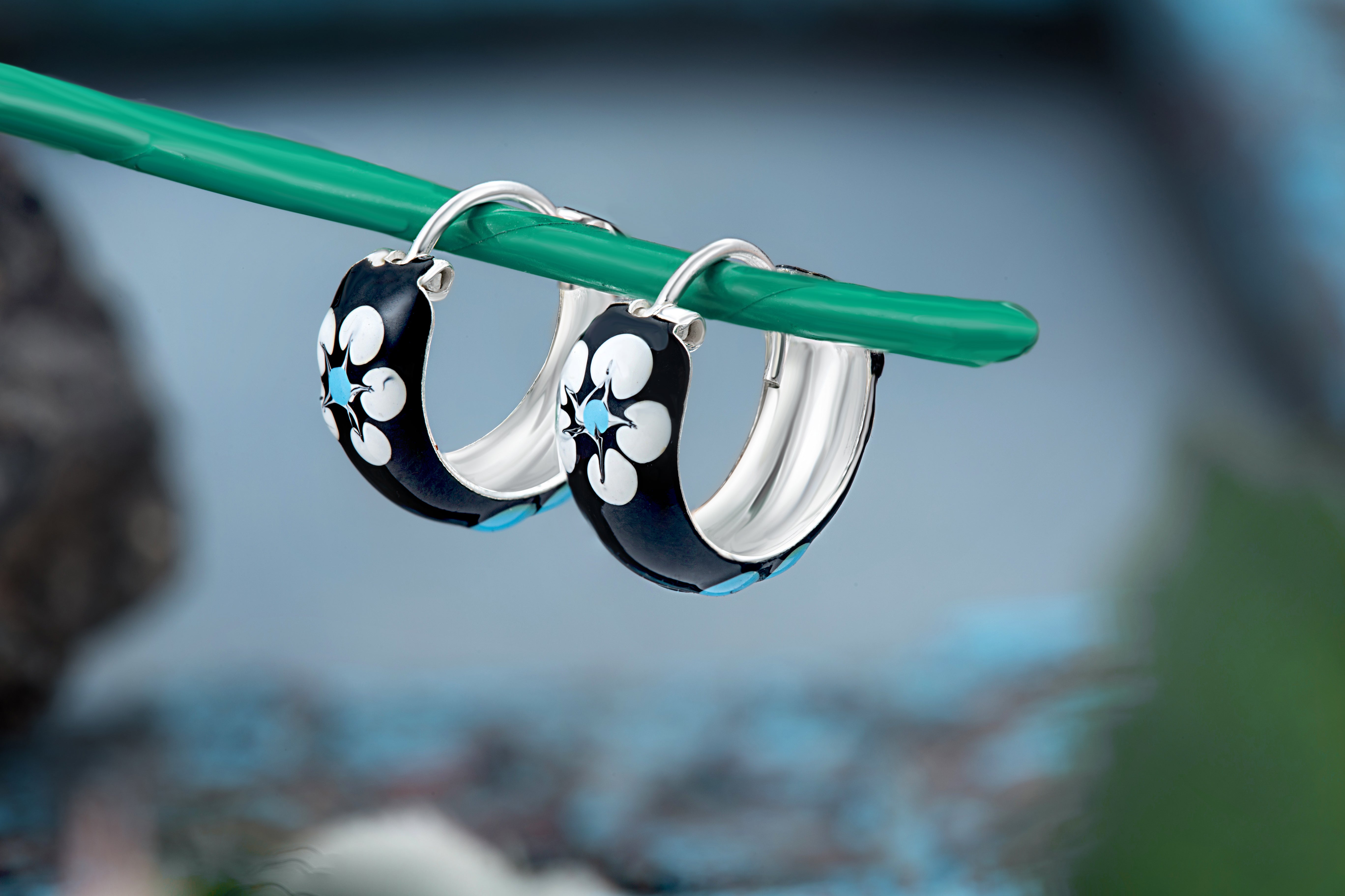 92.5 sterling silver hoops/baali with enamel and printed flowers finished in silver and hinged back closure