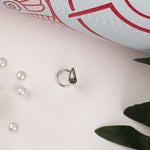 Sterling Silver wired nose pin with marcasite stone in paisley motif.