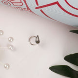 Sterling Silver wired nose pin with marcasite stone in paisley motif.