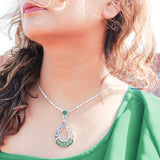 92.5 sterling silver pendant studded with white and green zirconias in the shape of drop