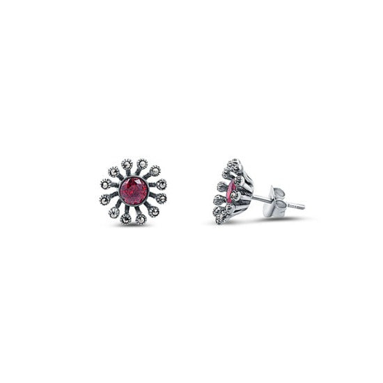 Sterling silver Flower inspired Stud earring for women. Oxidised finish and embellisehed with red color zirconia as a centre piece and Marcasites on its petals