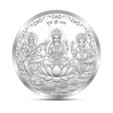 Circular silver coin with three deities on a white background