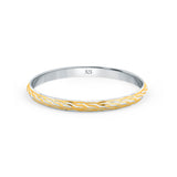 Gold and silver bangle with '925' stamp on a white background

