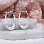 92.5 sterling silver hoops/baali  is finished in silver and latch back closure.