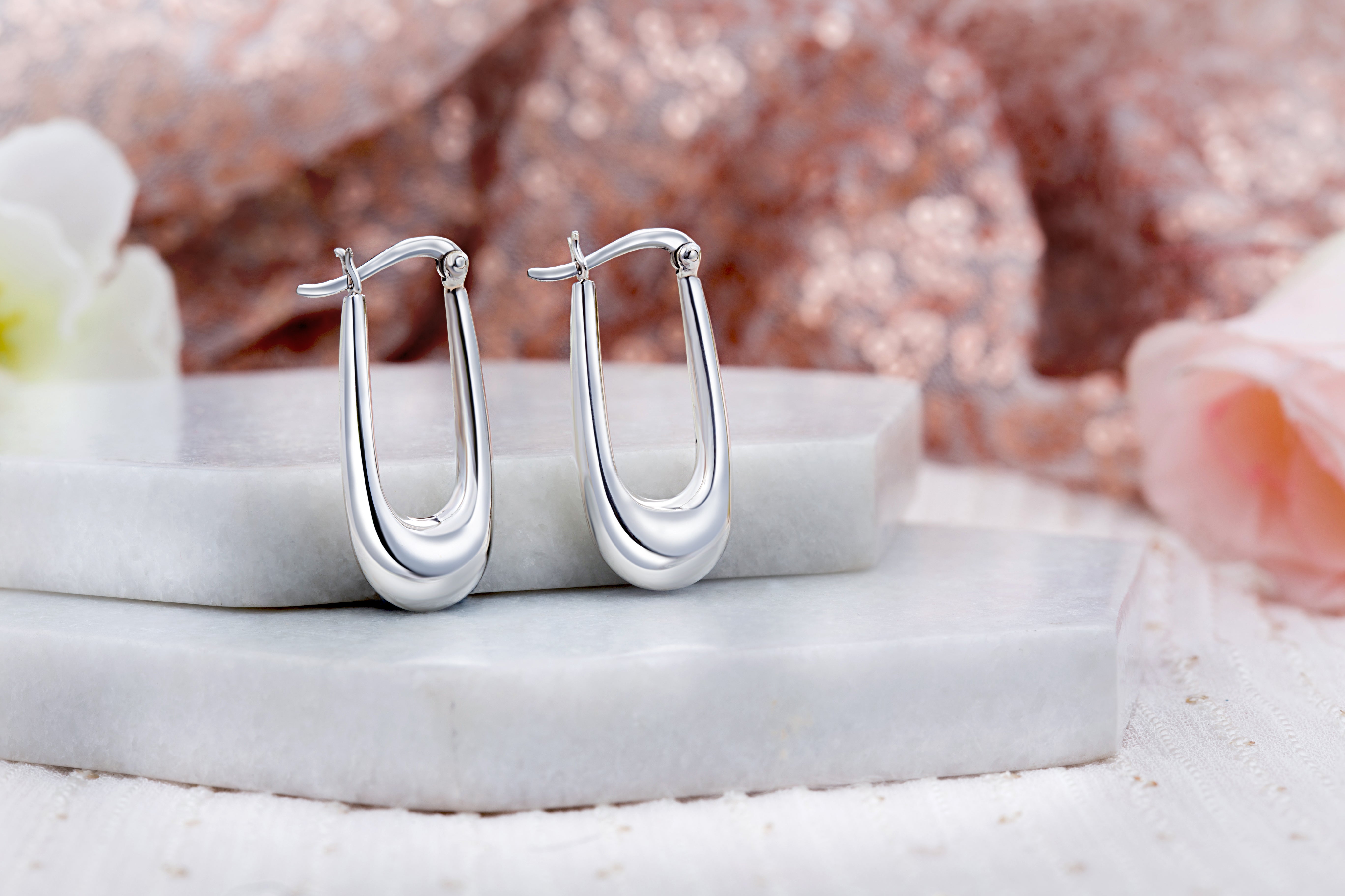 92.5 sterling silver hoops/baali  is finished in silver and latch back closure.