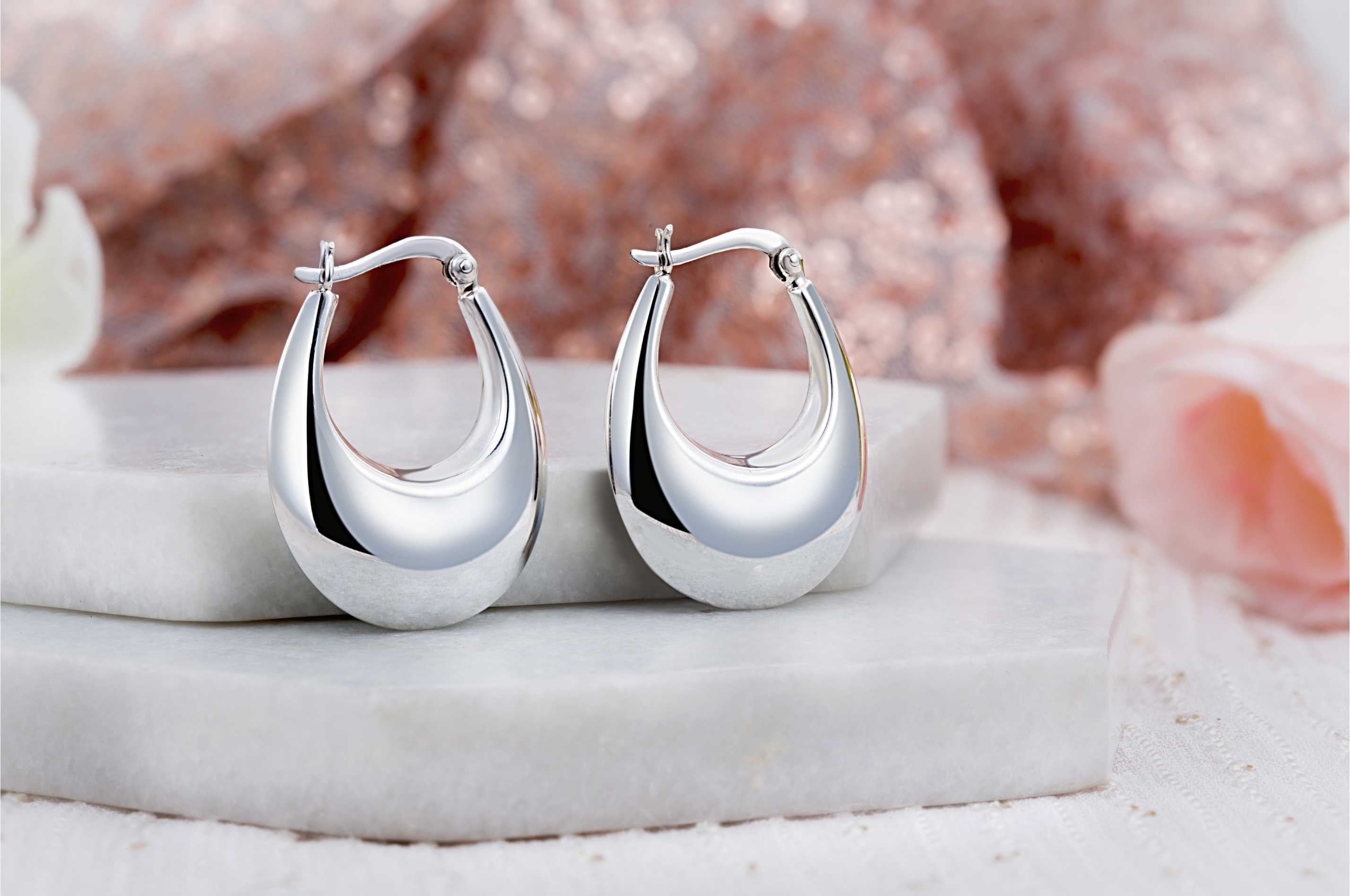92.5 sterling silver hoops/baali  is finished in silver and latch back closure.