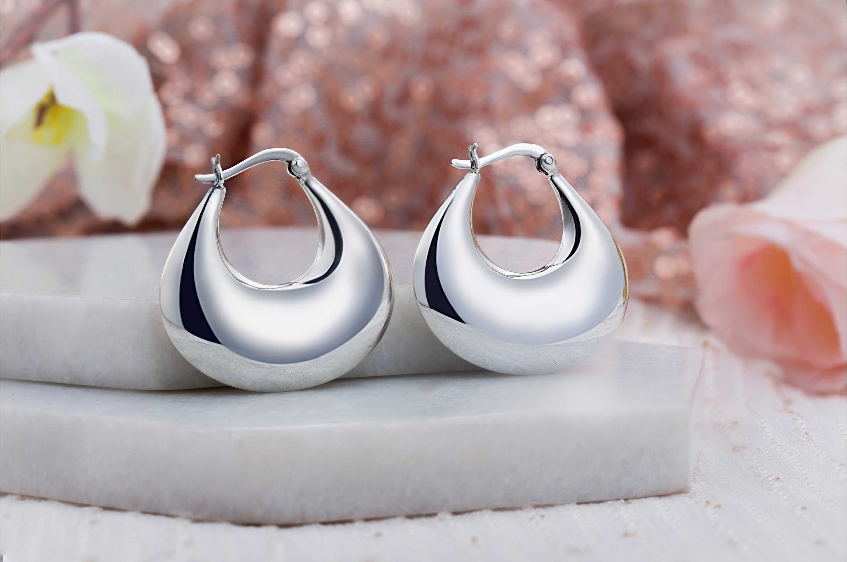 92.5 sterling silver hoops/baali  is finished in silver and latch back closure.