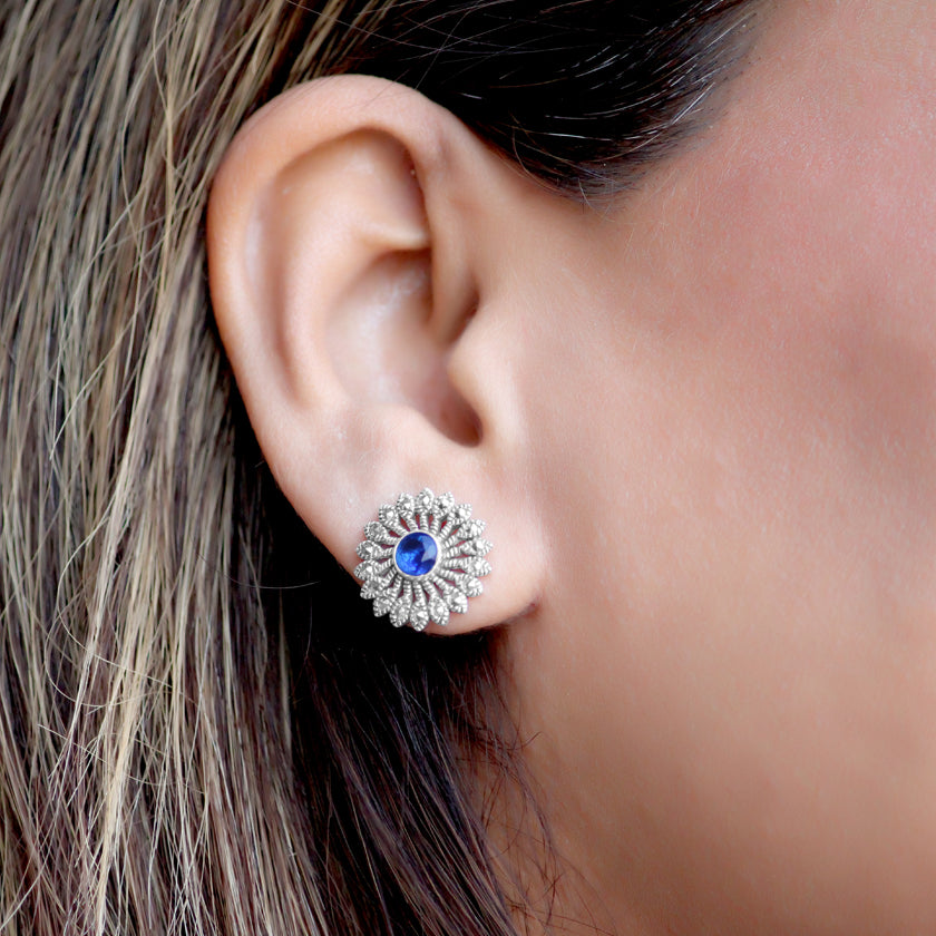 Introducing the Zainab Sterling Silver Studs, crafted with 925 sterling silver and an oxidised finish. Each stud is adorned with marcasite and a stunning blue zirconia center, delivering a touch of elegance to any outfit. Elevate your style with these timeless studs.