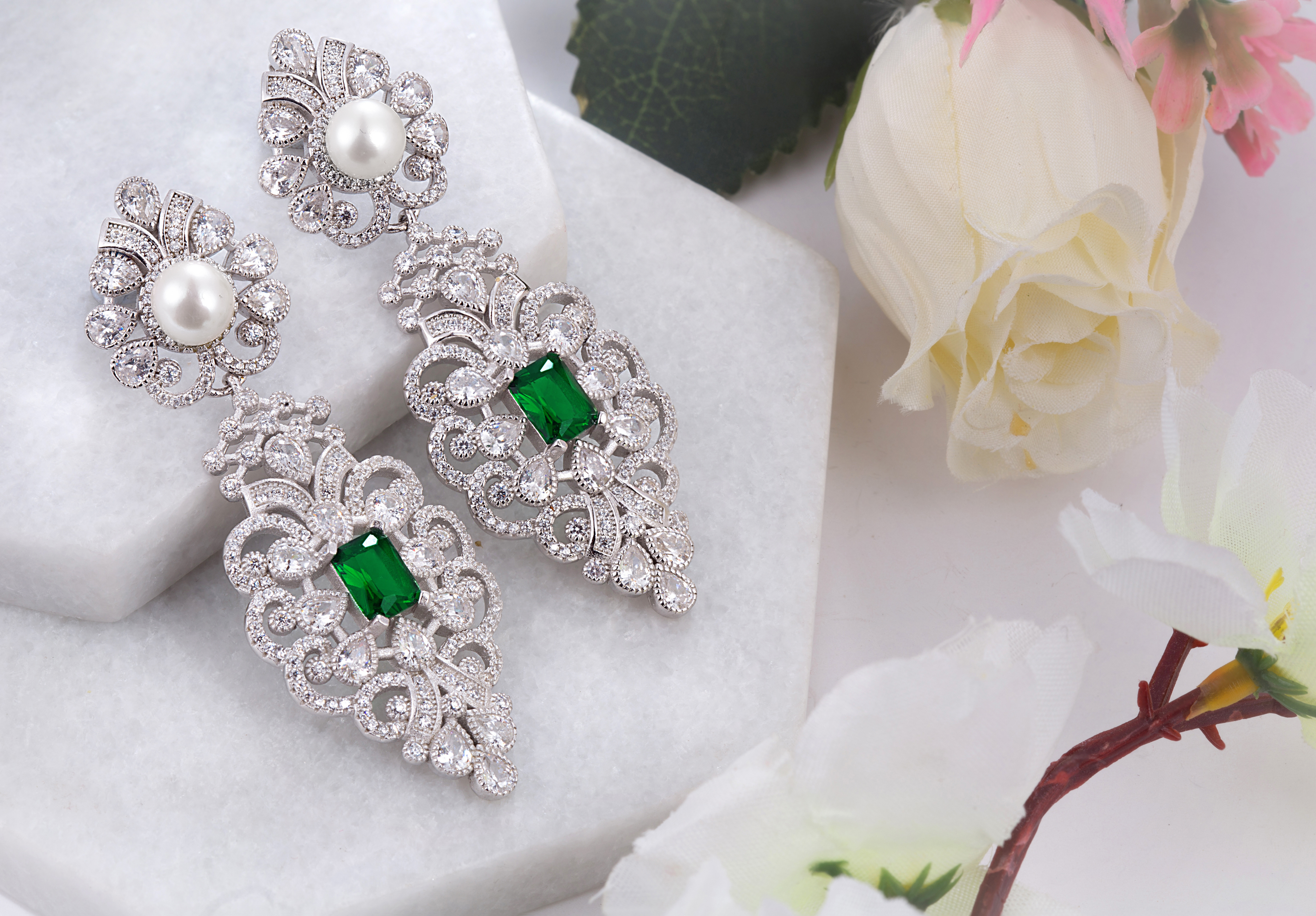 92.5 sterling silver chandelier earring embedded with green stone, sparkling zirconias and pearls from cocktail range