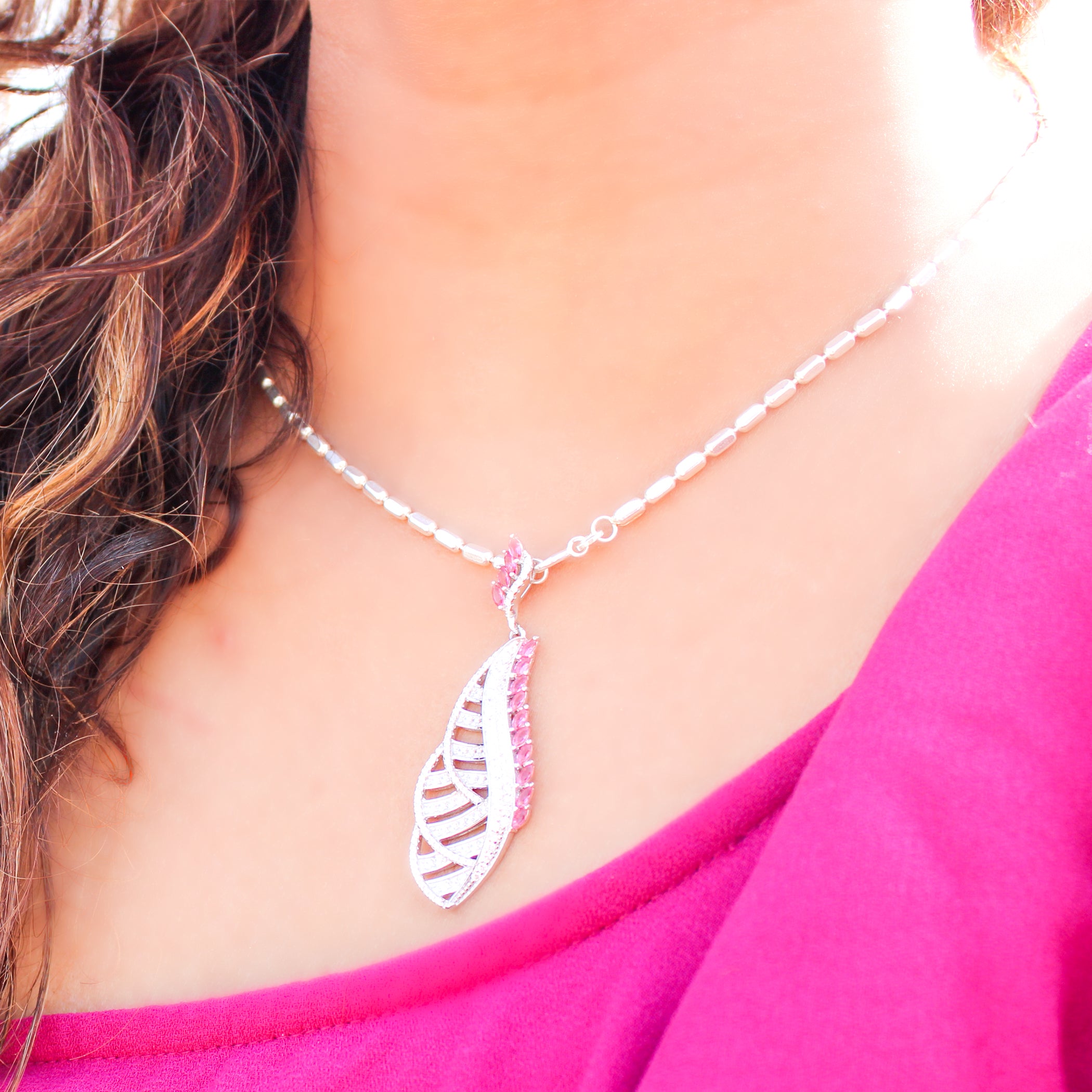 92.5 sterling silver pendant studded with white & pink zirconias in the shape of leaves
