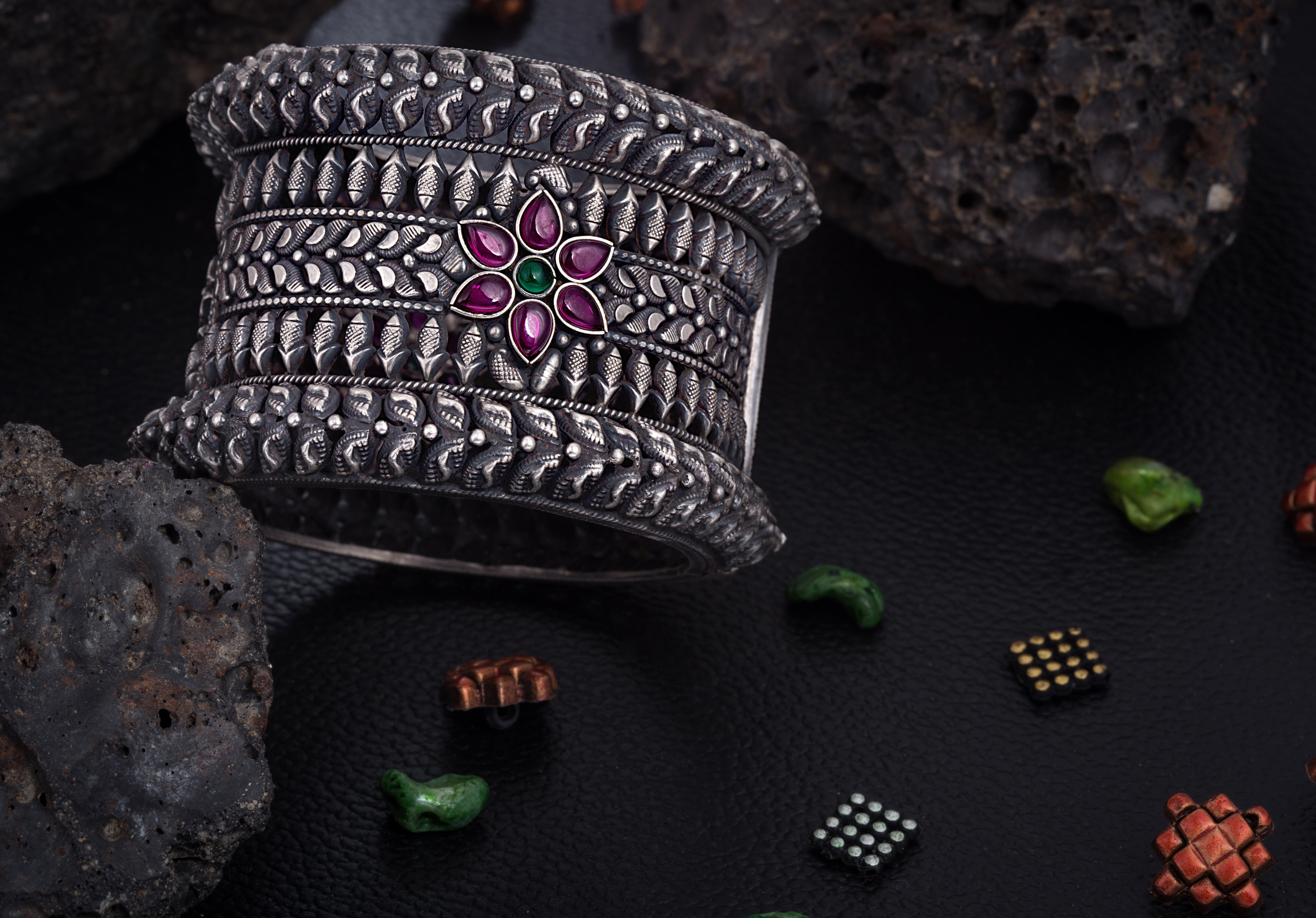 92.5 Sterling Silver Kada with floral patterns in antique finish studded with ruby and emerald