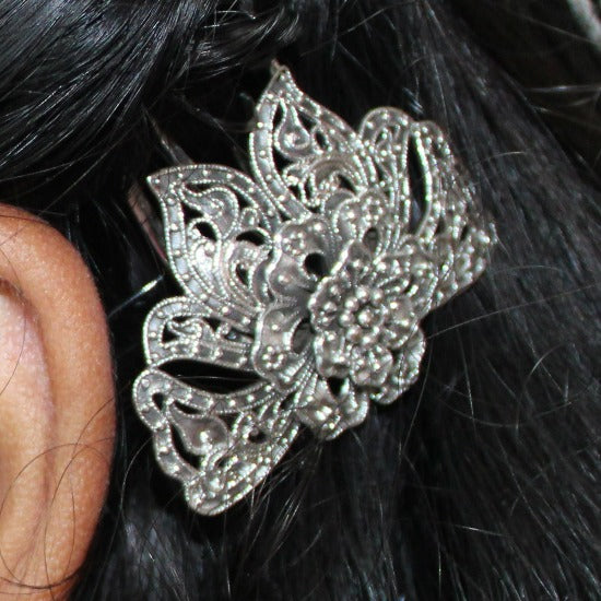 Add elegant style to any look with this sterling silver Babushka hair clip with Oxidised Finish. Featuring a beautiful flower and leaf motif and pin closure, this delicate hair accessory is a perfect gift for her. Treat your wife, Mother, sisiter, Girl friend or daughter to a unique present with this special hair clip. Best Birthday Gift for girls. Unique Girls Accessory. Best gift for Anniversary. Unique Rakhi Gift for sister