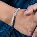 Add a touch of elegance to your outfit with the Ziva Silver Kada. Made of 925 sterling silver, this bracelet features a sparkling row of zirconias, adding a touch of glamour to any look. With its rhodium finish, this bracelet is not only beautiful but also durable.